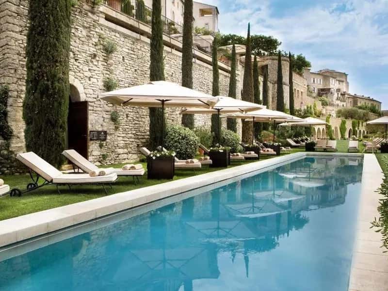 Pool and stone facade of La Bastide de Gordes, Provence