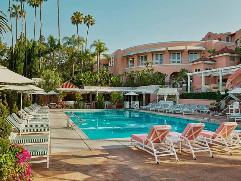The Beverly Hills Hotel pink facade with palm trees, Los Angeles