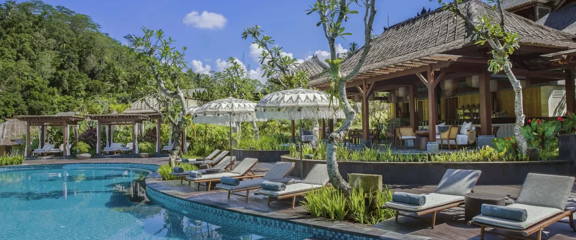 Mandapa Ritz-Carlton Reserve Bali poolside bar overlooking tropical jungle